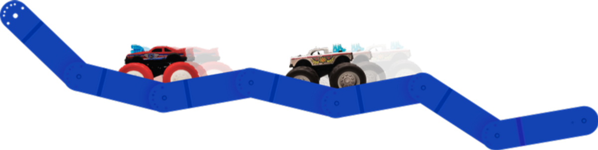 Bright blue Redi-Rampz track bent into a zigzag with two monster trucks